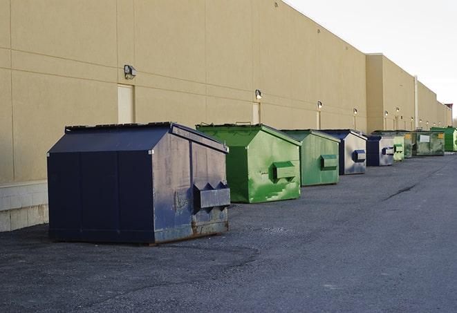 a row of industrial dumpsters for construction waste in El Lago TX